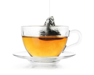 Cup with tea bag isolated on white