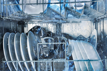 Details of the inside of a dishwasher in operation