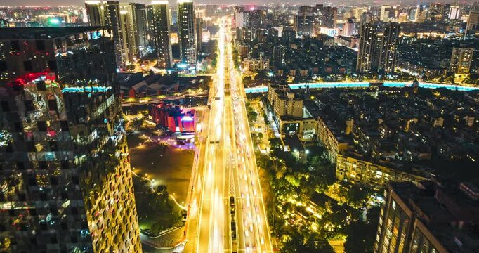 aerial view urban cityscape timelapse of traffic on the road with high buildings modern city of Chengdu China at twilight
