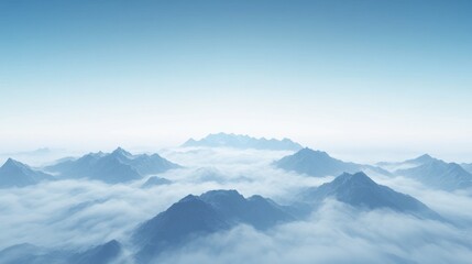 Fototapeta premium Breathtaking view of misty mountains under a clear blue sky, showcasing nature's beauty.