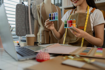 a beautiful female tailor is consulting and talking with a customer to make an agreement that the proposed clothing style matches the customer's requirements, designer, entrepreneur, sewing