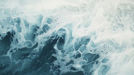 Obraz premium Dynamic ocean waves crashing with foam and vibrant teal hues, capturing nature's energy.