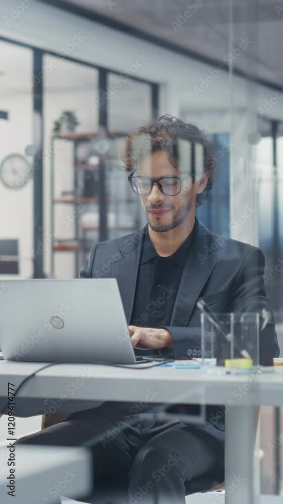 Aufkleber vertical screen: portrait of a manager reviewing sales reports on laptop computer. young man browsin