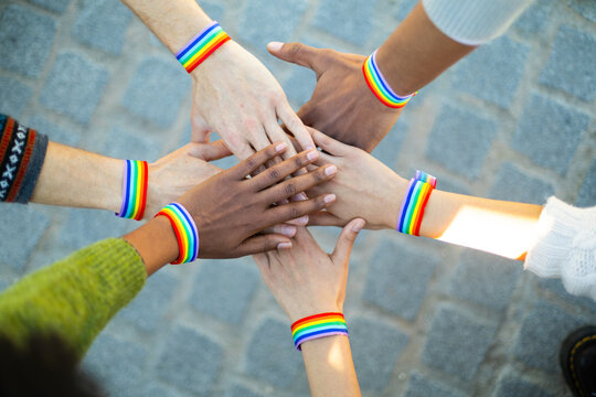 Activists showing support for lgbt community with rainbow bracelets