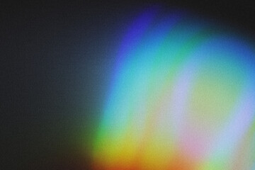 Colorful lens flare and haze on black background.