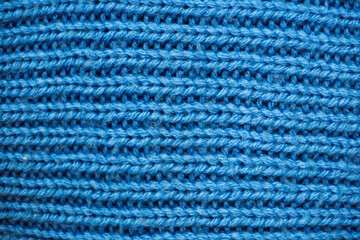 Seamless knitted fabric. Knitted sweater, plaid, scarf. Knitted background