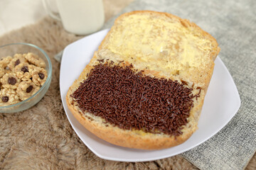 Bread with chocolate choco rice and butter with milk and snack for breakfast	
