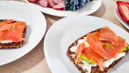 Breakfast celebration with smoked salmon on rye bread, perfect for a nutritious start, concept of healthy eating