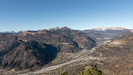 Panorama of the Carnic mountains from the top of Mount Giaideit, Friulian Alps. Sunny day and view from above of the villages of Carnia.