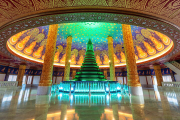 Obraz premium Temple with emerald-green glass pagoda. Buddhist temple of Wat Paknam Phasi Charoen, Bangkok, Thailand. Marble floor, ornate gilded columns and brightly decorated domed ceiling. 