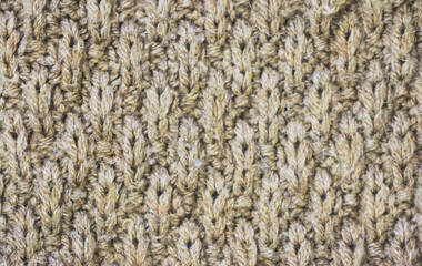 Knitwear texture. Handmade knitted natural fabric