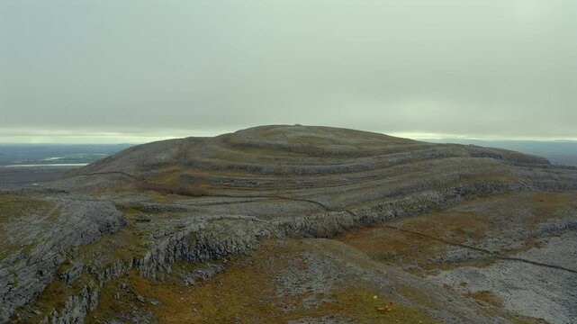 Aerial dolly of Mullaghmore summit, one of the most iconic hills in Burren National Park