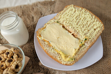Bread with scrambled egg sandwich on a plate for breakfast and coffee break	
