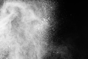 White snow falling down on black background