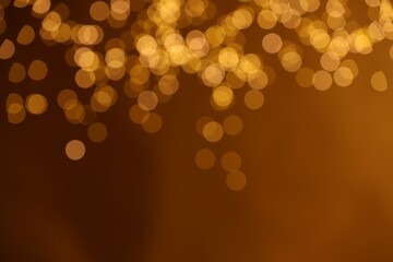 Golden background with blurred lights, bokeh effect