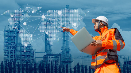 Professional Engineer petroleum industry worker with refinery overlay world wide map connection