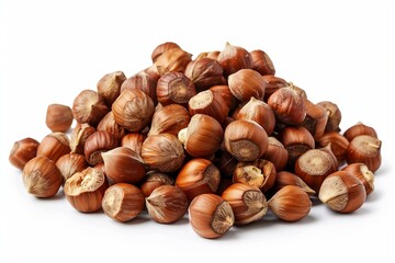 Fototapeta premium Pile of hazelnuts forming a small mountain isolated on white background