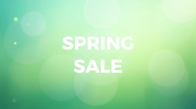 Spring sale text swirls on green background with sparkles and bokeh effect. Seasonal advertising design with bright atmosphere