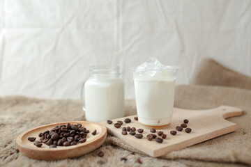 Delicious iced coffee, mocca, and chocolate drinks with coffee beans on white wooden table