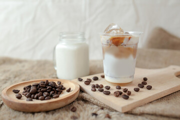 Delicious iced coffee, mocca, and chocolate drinks with coffee beans on white wooden table