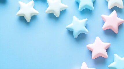 Obraz premium Pastel Stars Scattered On A Light Blue Background