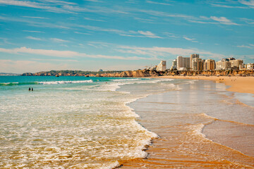  Stunning coastal views of Praia da Rocha with its golden sands and modern skyline.