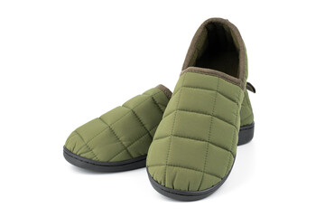 Soft slippers isolated on white background. Home slippers. Comfortable footwear for home. Foot care concept. Home comfort. Men's green slippers