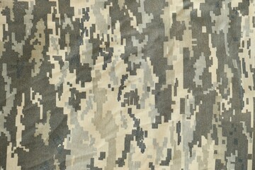 Texture of Dark green pixel camouflage military uniform textile cloth with folds