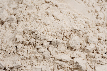 Protein powder in a measuring spoon. Bodybuilding, fitness and lifestyle in the gym. The concept of sports, health and nutrition	
