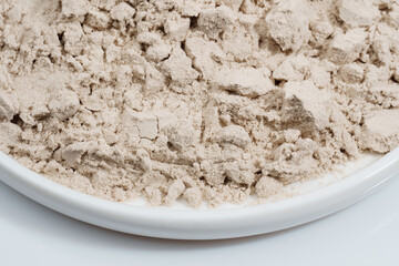 Protein powder in a measuring spoon. Bodybuilding, fitness and lifestyle in the gym. The concept of sports, health and nutrition	
