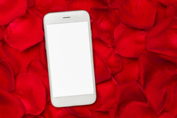 Smartphone mockup of blank screen on red rose petals background