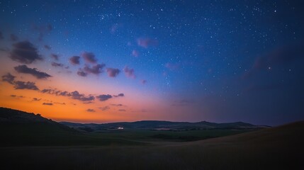 Obraz premium Starry Night over Rolling Hills: A Serene Landscape