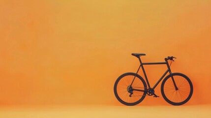 Fototapeta premium A minimalist steel-frame bicycle leaning against a vibrant orange background, highlighting its clean design