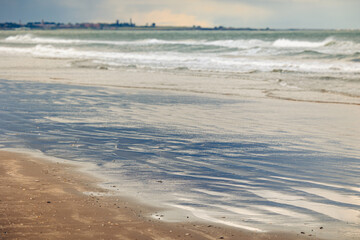 Views while walking on the beach in Portmarnock, on a windy spring day, Ireland