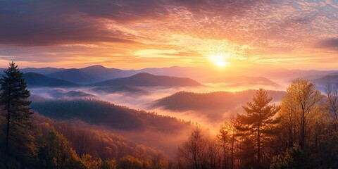 Obraz premium Majestic sunrise over layered mountains with warm orange and soft purple hues illuminating misty valleys, ideal for text overlay and reflection.