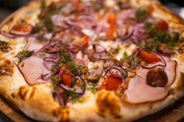 homemade fresh pizza with homemade sausage, ham, cheese sauce, dill, onion, French mustard, freshly...