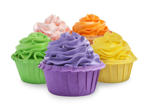Delicious cupcakes with colorful cream isolated on white