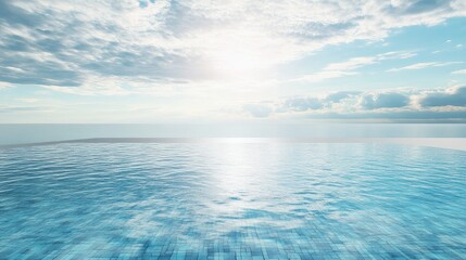 Infinity pool overlooking tranquil sea under a bright sky with soft clouds creating a serene and peaceful atmosphere.