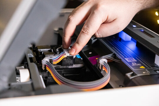 checking and adjusting printer ink tubes for maintenance and troubleshooting