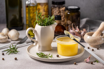 Aromatic ghee butter with rosemary and spices enhancing culinary delights