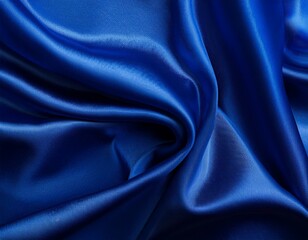 Fototapeta premium Dark blue silk satin background. Bright folds on a shiny fabric