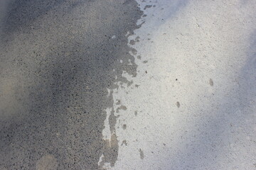 wet footprints on the asphalt