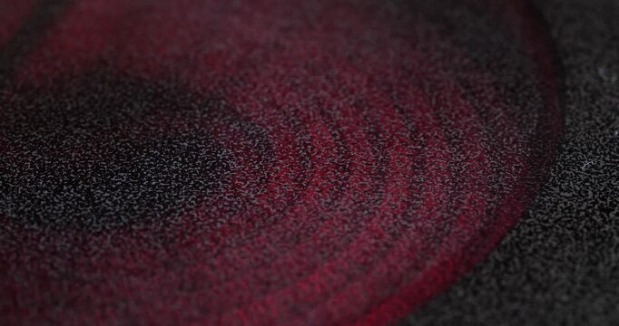 Electric or induction stove being turned on. Glowing red-hot plate, close up, macro shot, real time, no people