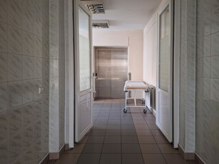 Hospital corridor with medical equipment at dawn