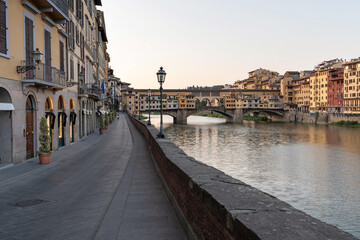Fototapeta premium Arno River and Ponte Vecchio at sunrise. Florence, Tuscany