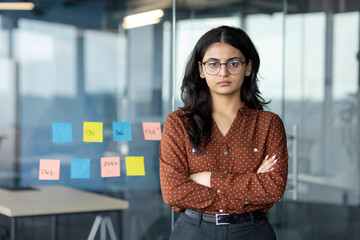 Portrait of successful confident businesswoman, office worker with crossed arms looking at camera....