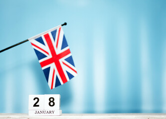 January calendar with British flag with number  28.  Calendar cubes with numbers. Space copy.