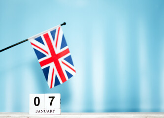 January calendar with British flag with number  7.  Calendar cubes with numbers. Space copy.