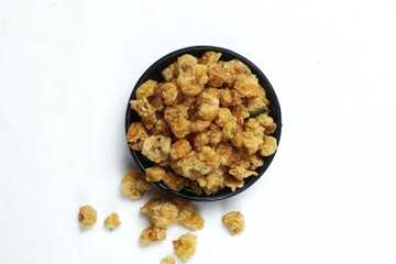 A small portion of fried corn nuts isolated on a white background.