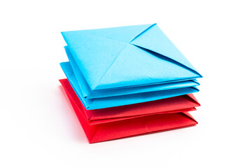 Square envelope made of red and blue paper. Origami envelope on white background